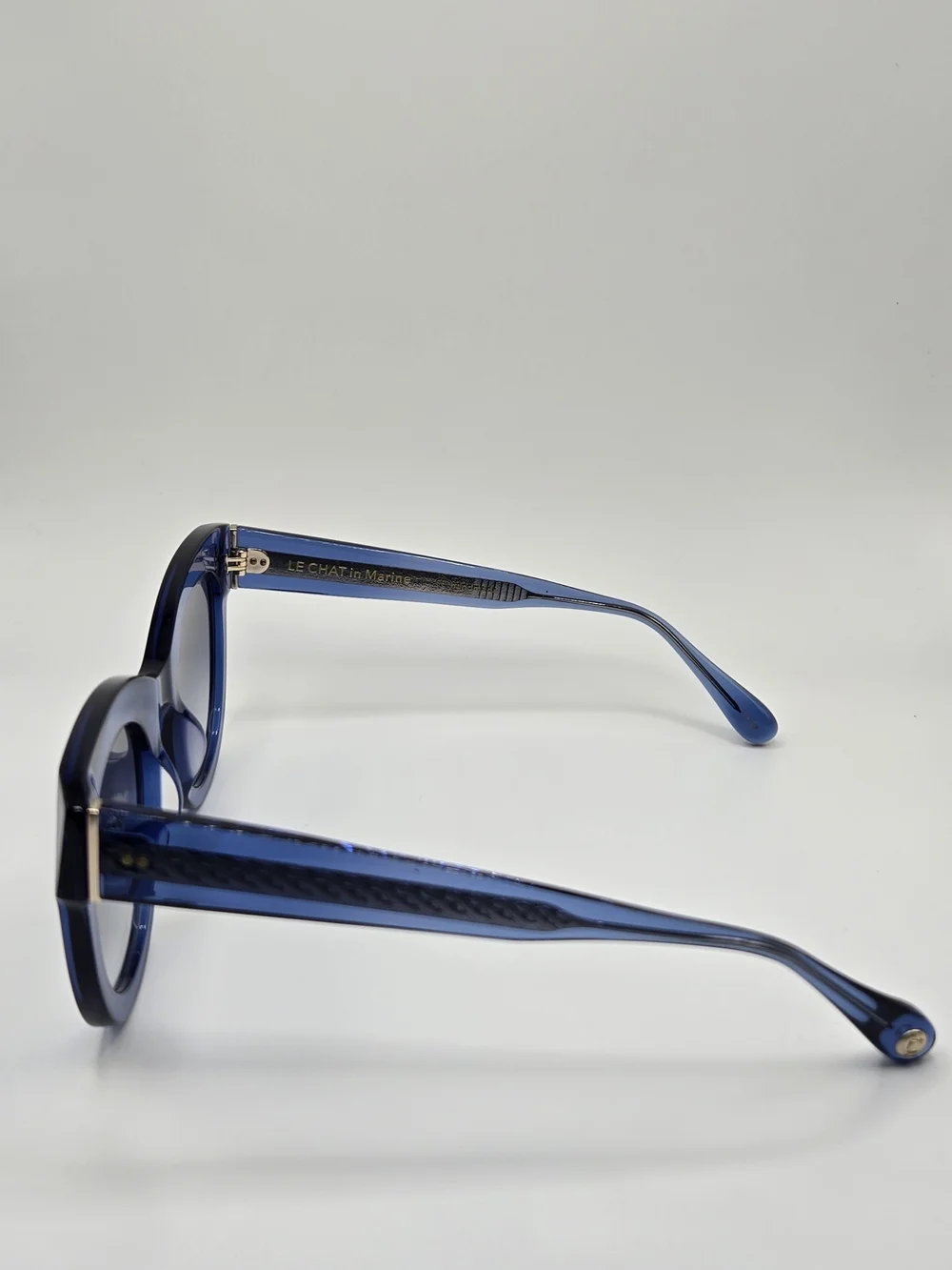 Aperçu sunglasses featuring a bold acetate frame and gold tone branding